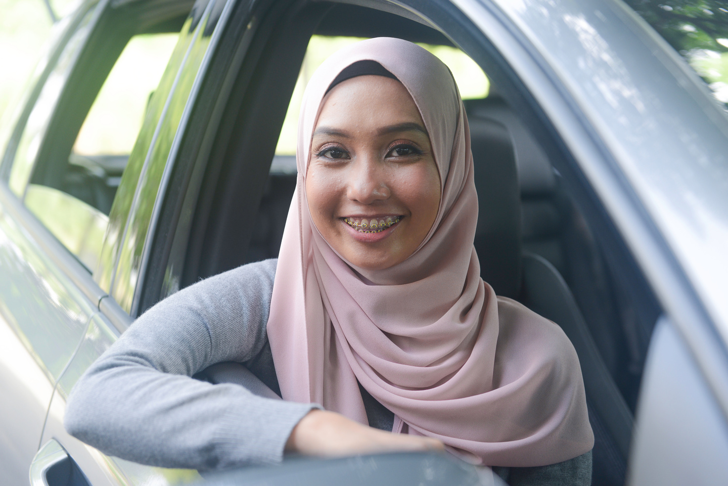 A young Muslim lady driver in Kuala Lumpur, Malaysia